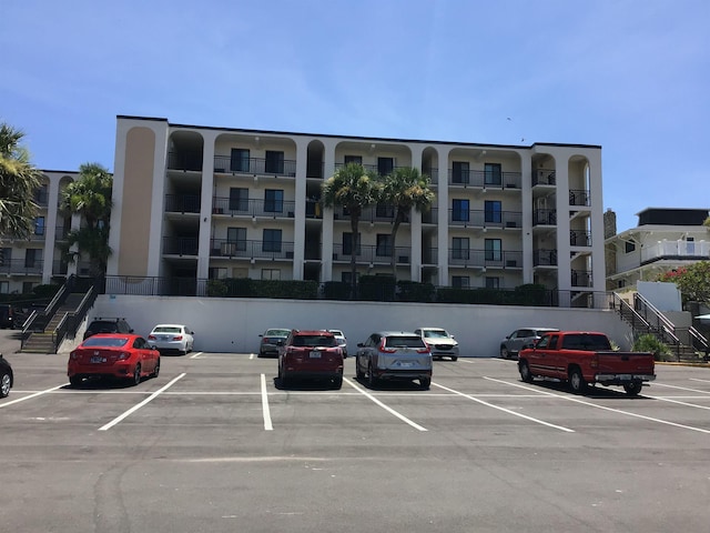 6970 A1A S Unit 106, Saint Augustine, FL 32080 - view of apartment building / complex with uncovered parking and stairs