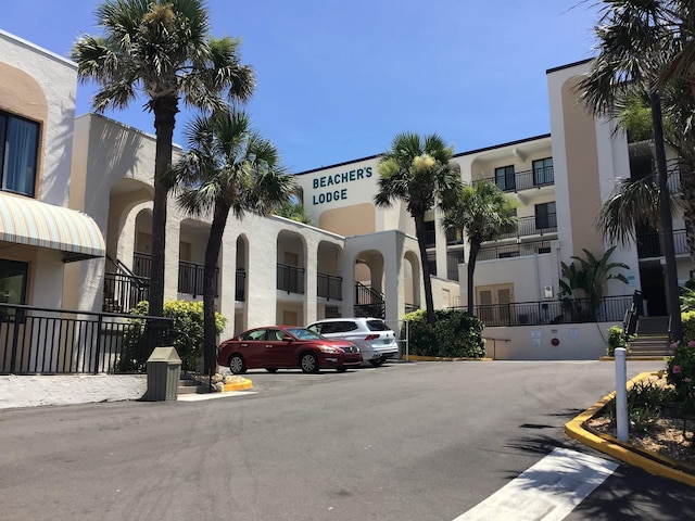 6970 A1A S Unit 106, Saint Augustine, FL 32080 - view of building exterior with uncovered parking