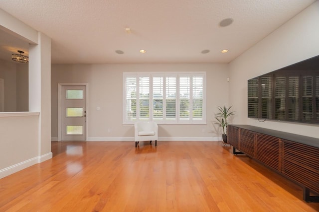 517 Weeping Willow Ln, Saint Augustine, FL 32080 - spare room with wood finished floors, baseboards, and recessed lighting