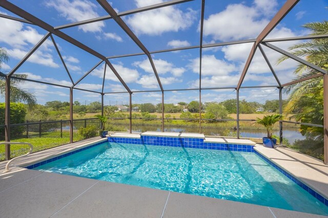 517 Weeping Willow Ln, Saint Augustine, FL 32080 - swimming pool with a water view, a lanai, and a patio