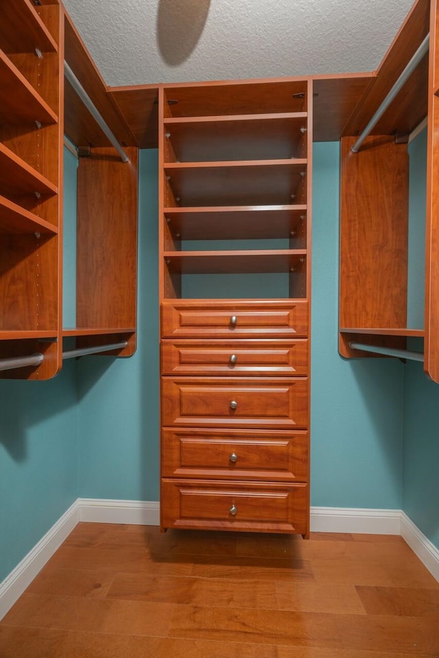 517 Weeping Willow Ln, Saint Augustine, FL 32080 - walk in closet featuring wood finished floors