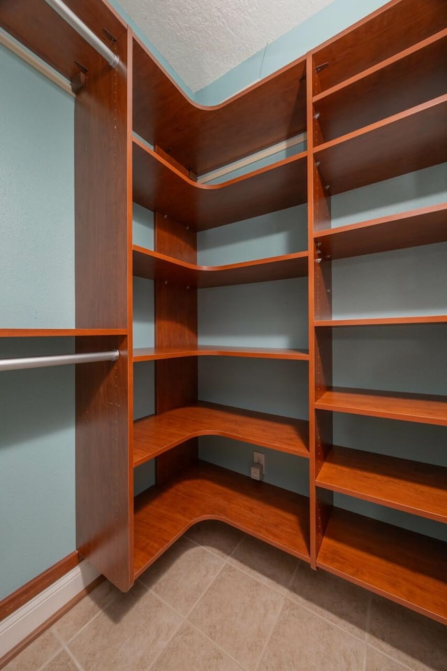 517 Weeping Willow Ln, Saint Augustine, FL 32080 - spacious closet featuring tile patterned flooring