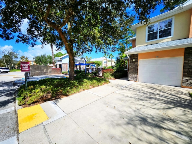 view of side of property featuring a garage