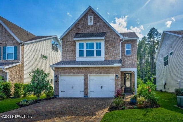 view of front facade featuring a garage, decorative driveway, brick siding, and a shingled roof