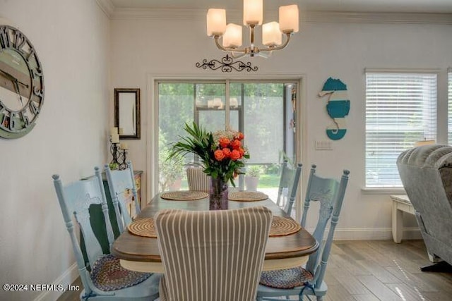114 Silver Creek Pl, Saint Augustine, FL 32095 - dining room with ornamental molding, light wood-type flooring, a chandelier, and baseboards
