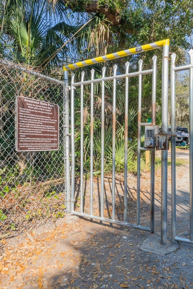 view of gate with fence