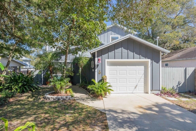 1684 Leon St, Saint Augustine, FL 32080 - view of front of house featuring concrete driveway, board and batten siding, and an attached garage
