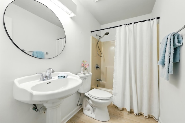 1684 Leon St, Saint Augustine, FL 32080 - bathroom with wood finished floors, toilet, shower / tub combo with curtain, and a sink
