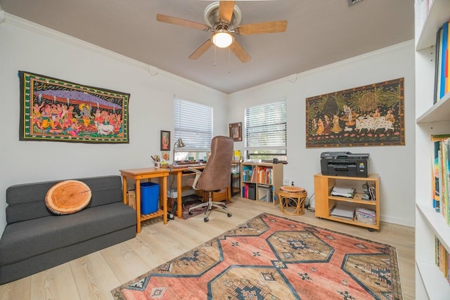 home office with ornamental molding, wood finished floors, a ceiling fan, and baseboards