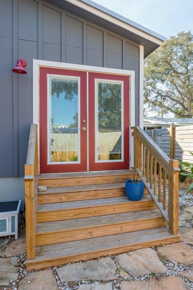 view of exterior entry with board and batten siding