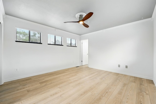 1684 Leon St, Saint Augustine, FL 32080 - empty room featuring a ceiling fan, healthy amount of natural light, ornamental molding, light wood finished floors, and baseboards