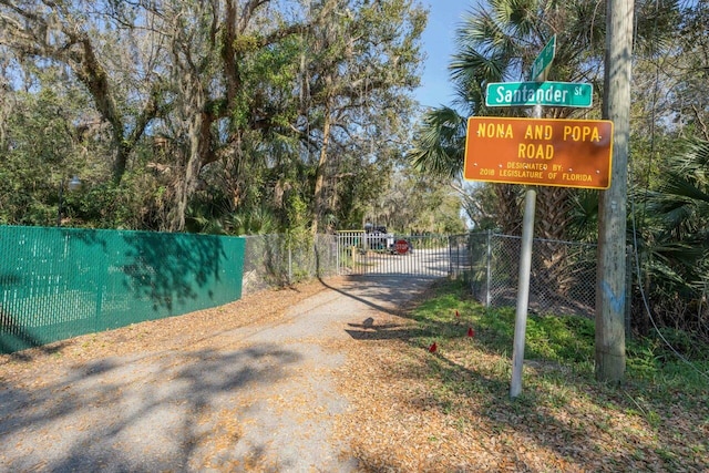 view of road featuring a gate