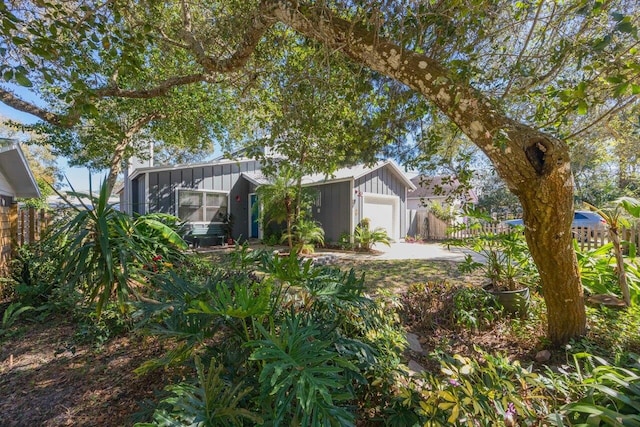 1684 Leon St, Saint Augustine, FL 32080 - view of front of property featuring board and batten siding, a garage, and driveway