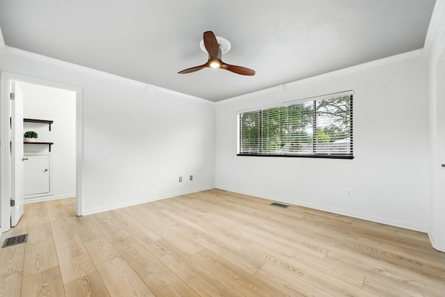1684 Leon St, Saint Augustine, FL 32080 - unfurnished room featuring ornamental molding, light wood-type flooring, a ceiling fan, and baseboards