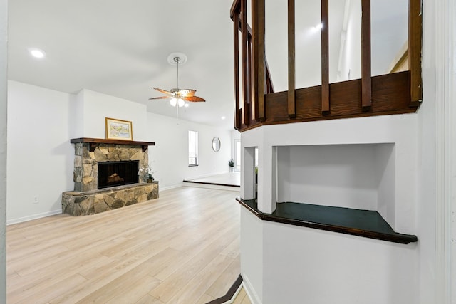 1684 Leon St, Saint Augustine, FL 32080 - unfurnished living room with a fireplace, a ceiling fan, light wood-style floors, baseboards, and recessed lighting