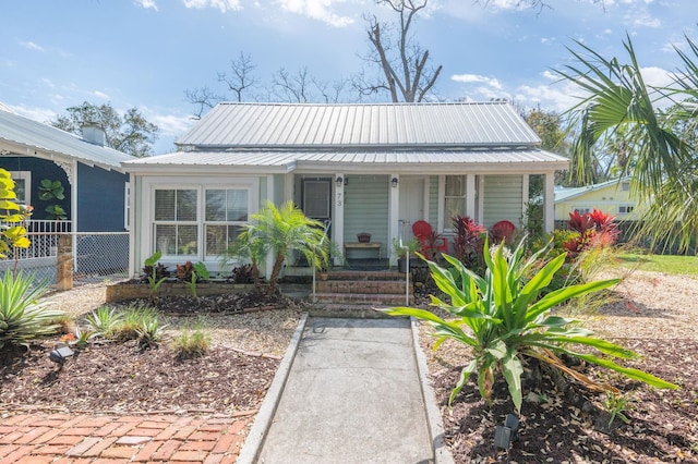 73 Kings Ferry Way, Saint Augustine, FL 32084 - bungalow featuring metal roof, covered porch, and fence
