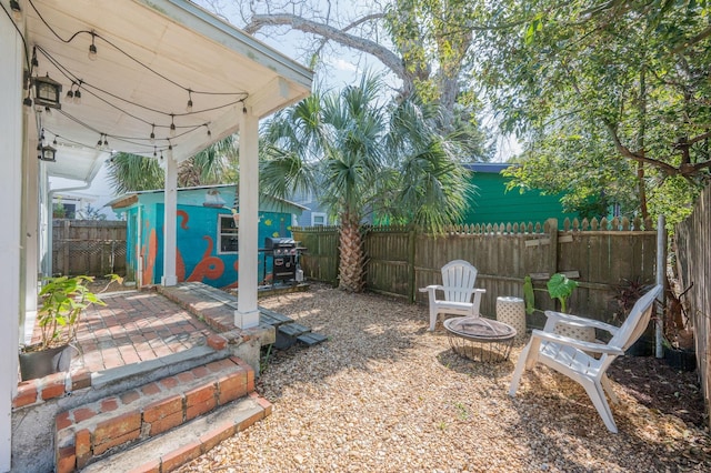 73 Kings Ferry Way, Saint Augustine, FL 32084 - view of yard with a patio, an outbuilding, a fenced backyard, and an outdoor fire pit