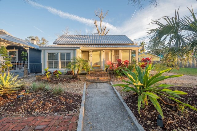 73 Kings Ferry Way, Saint Augustine, FL 32084 - bungalow with fence, covered porch, and metal roof