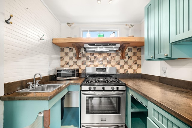 73 Kings Ferry Way, Saint Augustine, FL 32084 - kitchen with a sink, green cabinetry, dark countertops, and appliances with stainless steel finishes