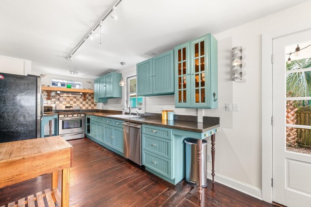 73 Kings Ferry Way, Saint Augustine, FL 32084 - kitchen featuring a sink, dark wood-type flooring, dark countertops, and appliances with stainless steel finishes