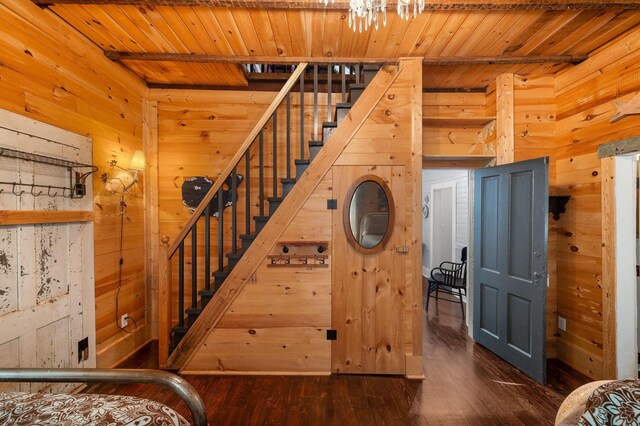 73 Kings Ferry Way, Saint Augustine, FL 32084 - staircase featuring wood walls, wooden ceiling, and wood finished floors