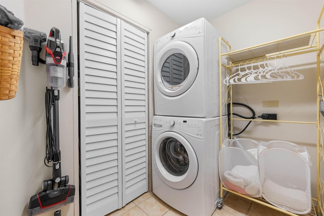 113 Laurel Wood Way Unit 101, Saint Augustine, FL 32086 - clothes washing area with laundry area, stacked washer / drying machine, and light tile patterned flooring