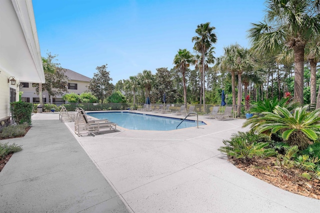 pool featuring a patio and fence