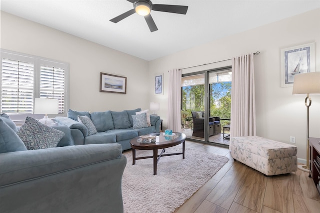 living area featuring ceiling fan and wood finished floors