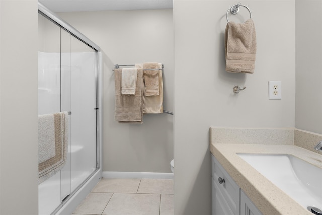 113 Laurel Wood Way Unit 101, Saint Augustine, FL 32086 - full bathroom featuring vanity, tile patterned floors, a stall shower, and toilet