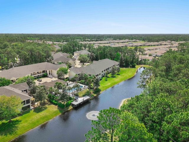 birds eye view of property with a water view and a residential view