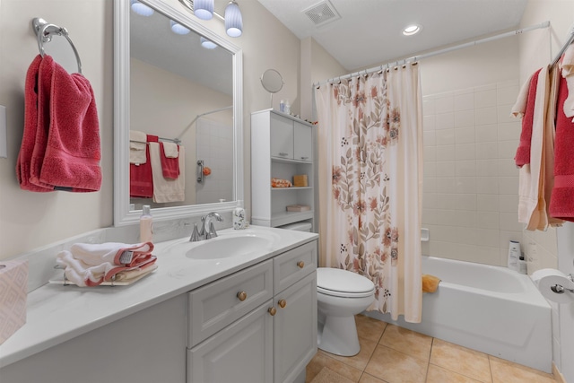 full bath with shower / bath combo, tile patterned flooring, vanity, toilet, and visible vents