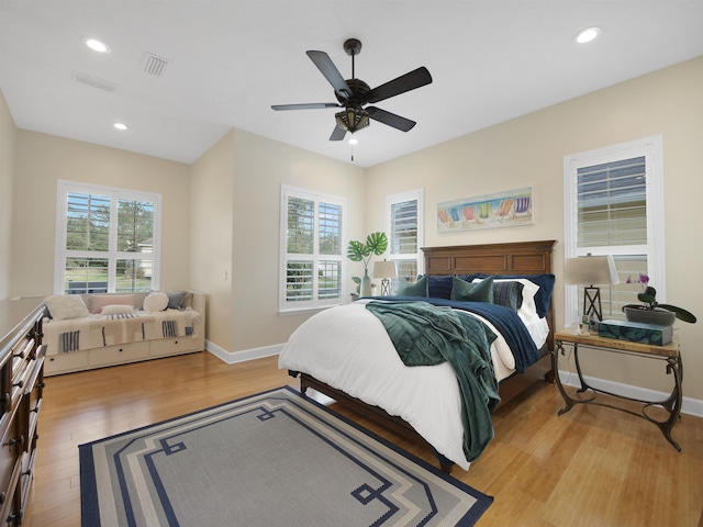 bedroom featuring light wood finished floors, recessed lighting, visible vents, a ceiling fan, and baseboards