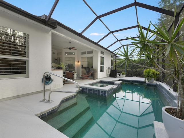 view of pool featuring ceiling fan, a patio area, a lanai, and a pool with connected hot tub