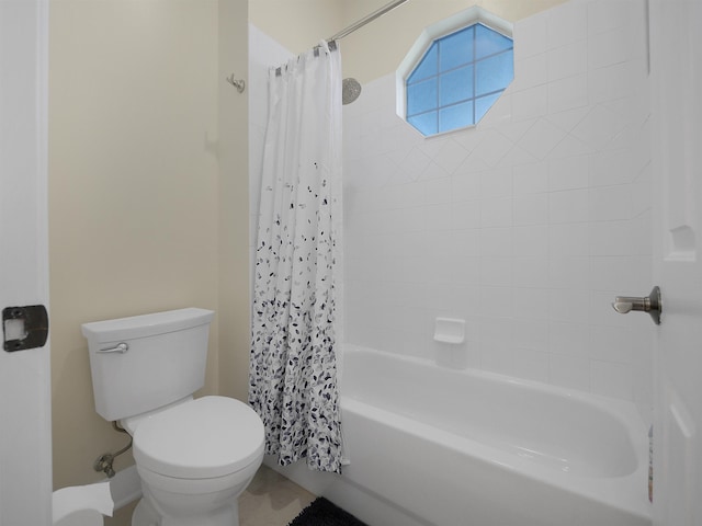 bathroom with shower / tub combo and toilet