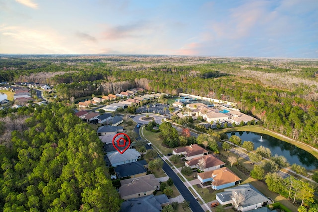 drone / aerial view featuring a water view and a residential view