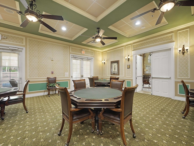 dining space with ornamental molding, carpet, coffered ceiling, and a decorative wall