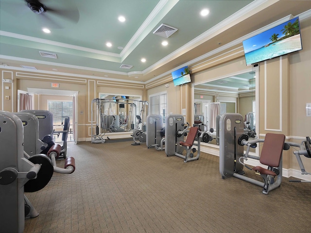 workout area with recessed lighting, a raised ceiling, visible vents, and crown molding