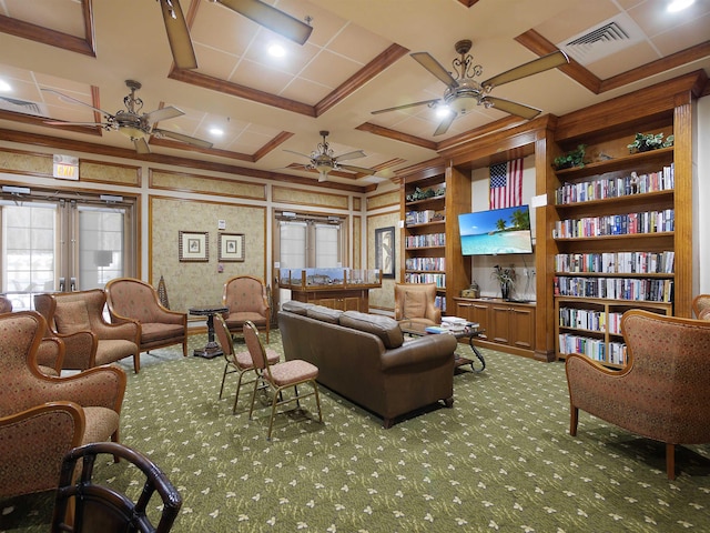 carpeted living area featuring built in features, visible vents, coffered ceiling, and a ceiling fan