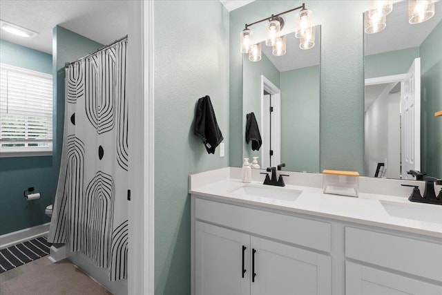 839 Lightsey Crossing Ln, Saint Augustine, FL 32084 - bathroom featuring double vanity and a textured wall