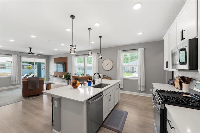 839 Lightsey Crossing Ln, Saint Augustine, FL 32084 - kitchen with appliances with stainless steel finishes, light countertops, light wood finished floors, recessed lighting, and a ceiling fan