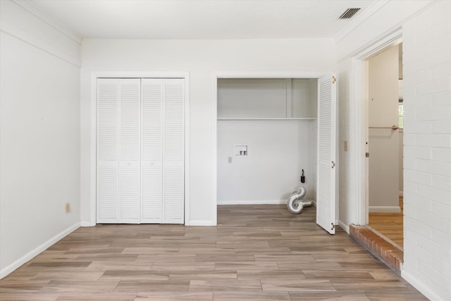 washroom with washer hookup and light wood-type flooring