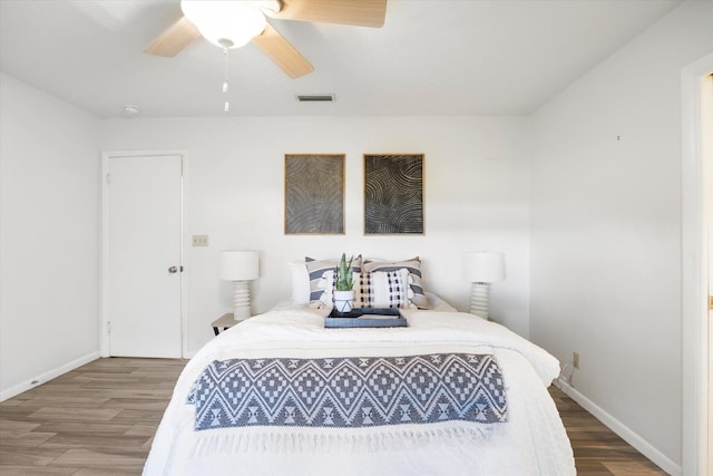 bedroom with hardwood / wood-style flooring and ceiling fan