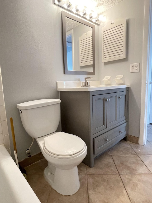 8130 A1A S Unit D-2, Saint Augustine, FL 32080 - full bathroom with tile patterned flooring, toilet, vanity, and baseboards