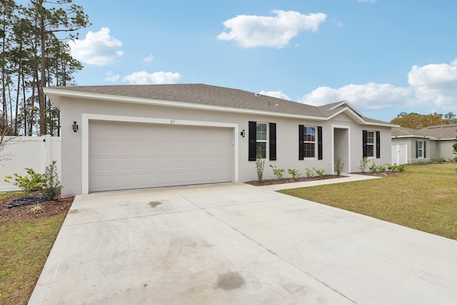 ranch-style house with fence, an attached garage, stucco siding, a front lawn, and concrete driveway