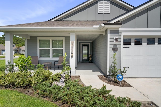 view of exterior entry featuring covered porch