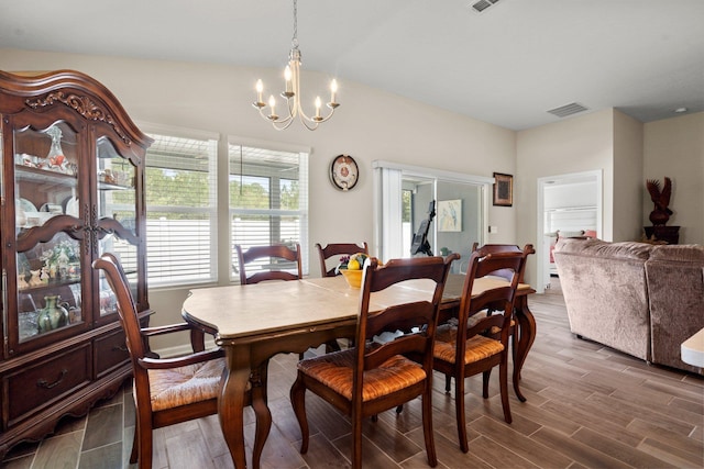 dining room with a chandelier and wood-type flooring