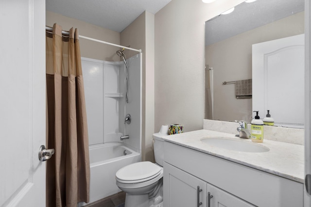 full bathroom with vanity, shower / bath combination with curtain, toilet, and a textured ceiling