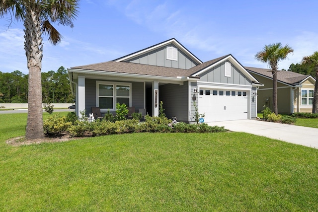 view of front facade featuring a front yard and a garage