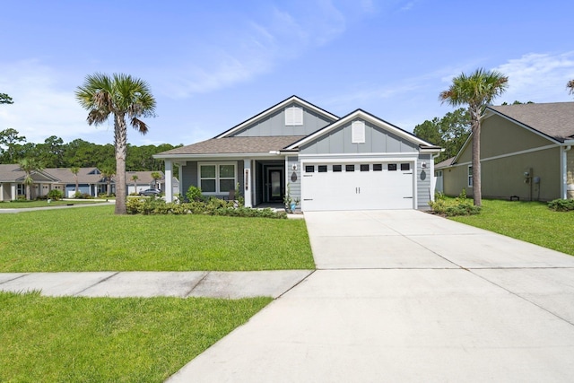 view of front facade with a front yard and a garage