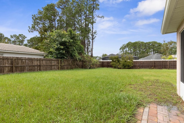 view of yard with a fenced backyard